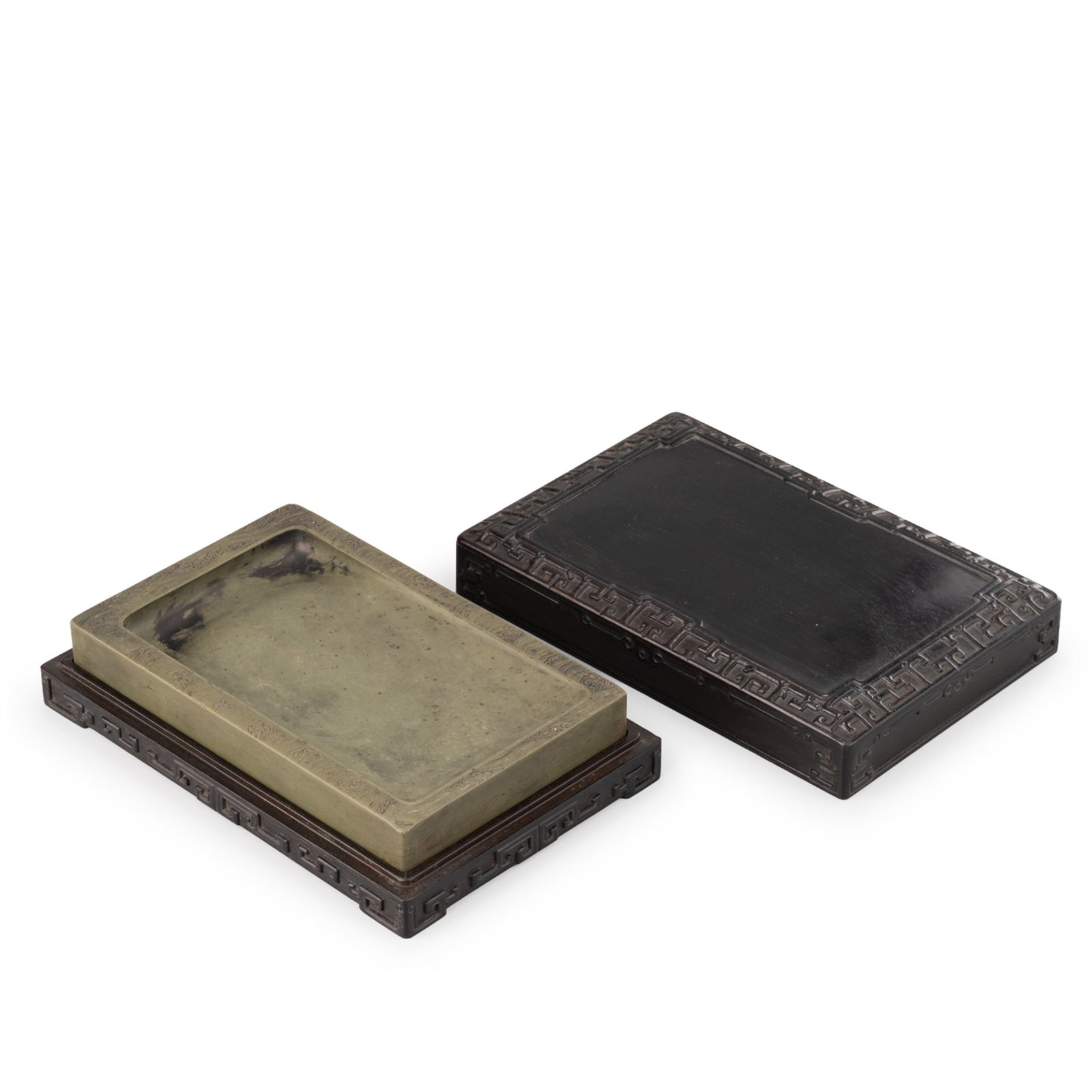 Duan Inkstone with Qianlong Mark: Rectangular green Duan inkstone of shallow form, the rim finely carved with a continuous wave pattern. The stone displays a soft olive-green tone with natural mineral inclusions and subtle tonal varia