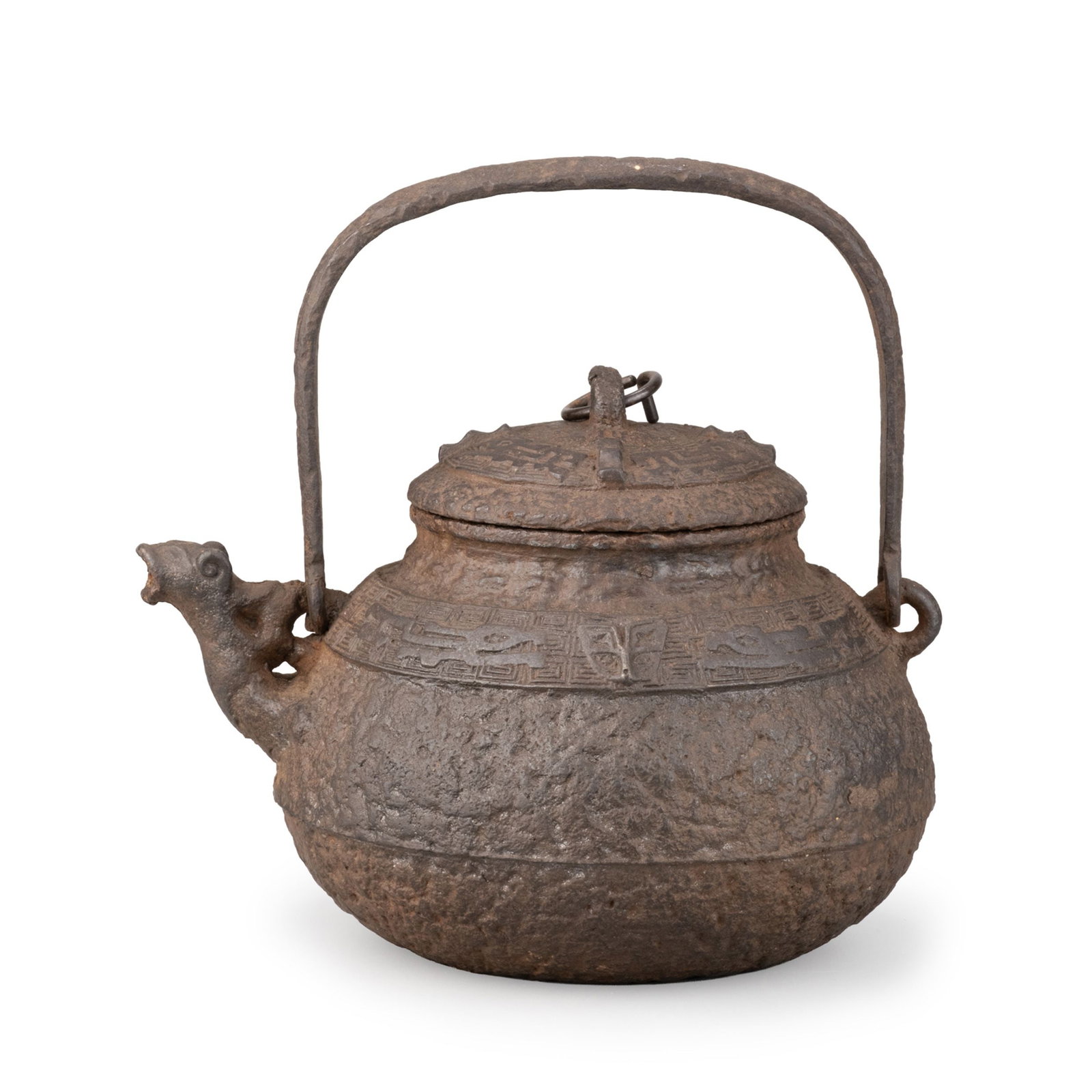 Iron Kettle,Signed: A traditional Japanese cast-iron tetsubin of rounded form with a high swing handle and domed cover. The body features a rugged rock-textured [iwahada] surface, creating a bold and naturalistic appeara