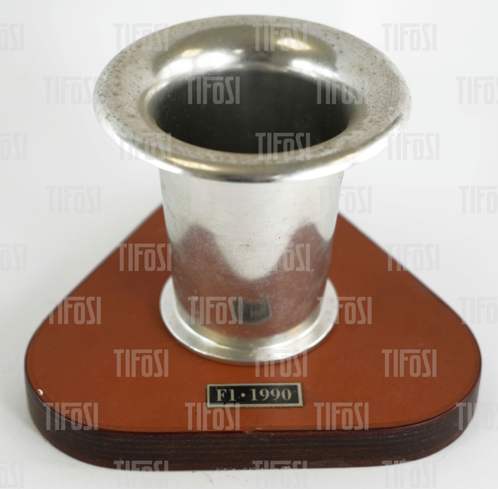 Ferrari Schedoni F1 Air Intake Ornament Paperweight: A rare genuine Ferrari ornament featuring an intake ram pipe from a F1 car mounted on a Schedoni branded leather base.