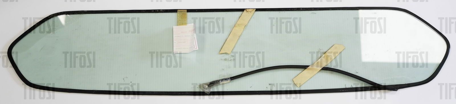 Ferrari 308 GT4 Dino Heated Rear Screen: An original heated rear screen from a Ferrari 308 GT4 Dino, some delamination in one corner, otherwise good.