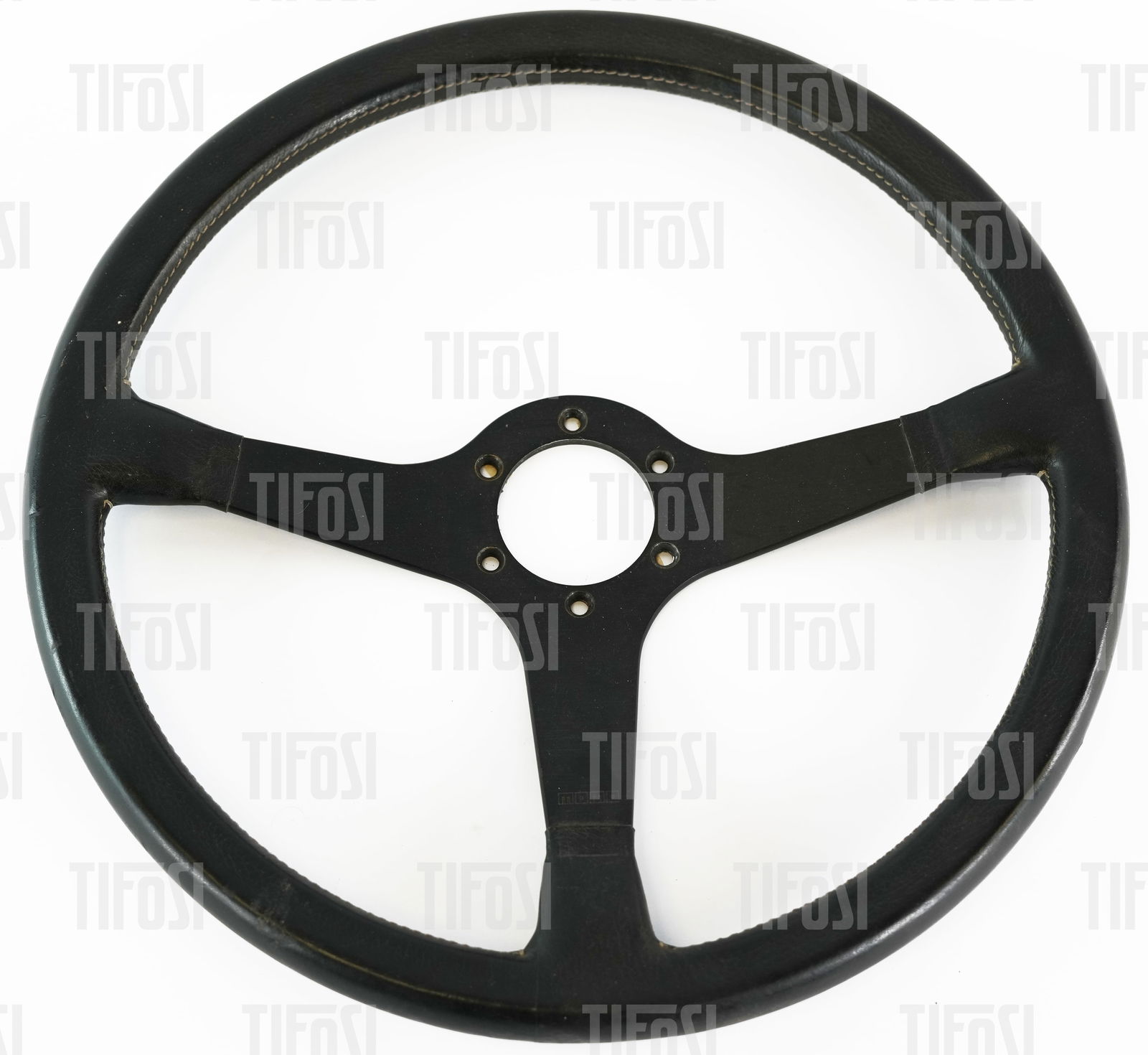 Ferrari 308 512 Bbi MOMO Steering Wheel: A rare original MOMO steering wheel to suit Ferrari 308 and 512 Bbi, good condition, dated July 1982 to the reverse.