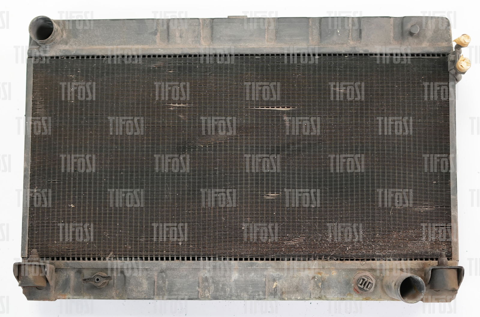 Ferrari 308 Radiator: A used radiator from a Ferrari 308, some bent fins but otherwise ok.