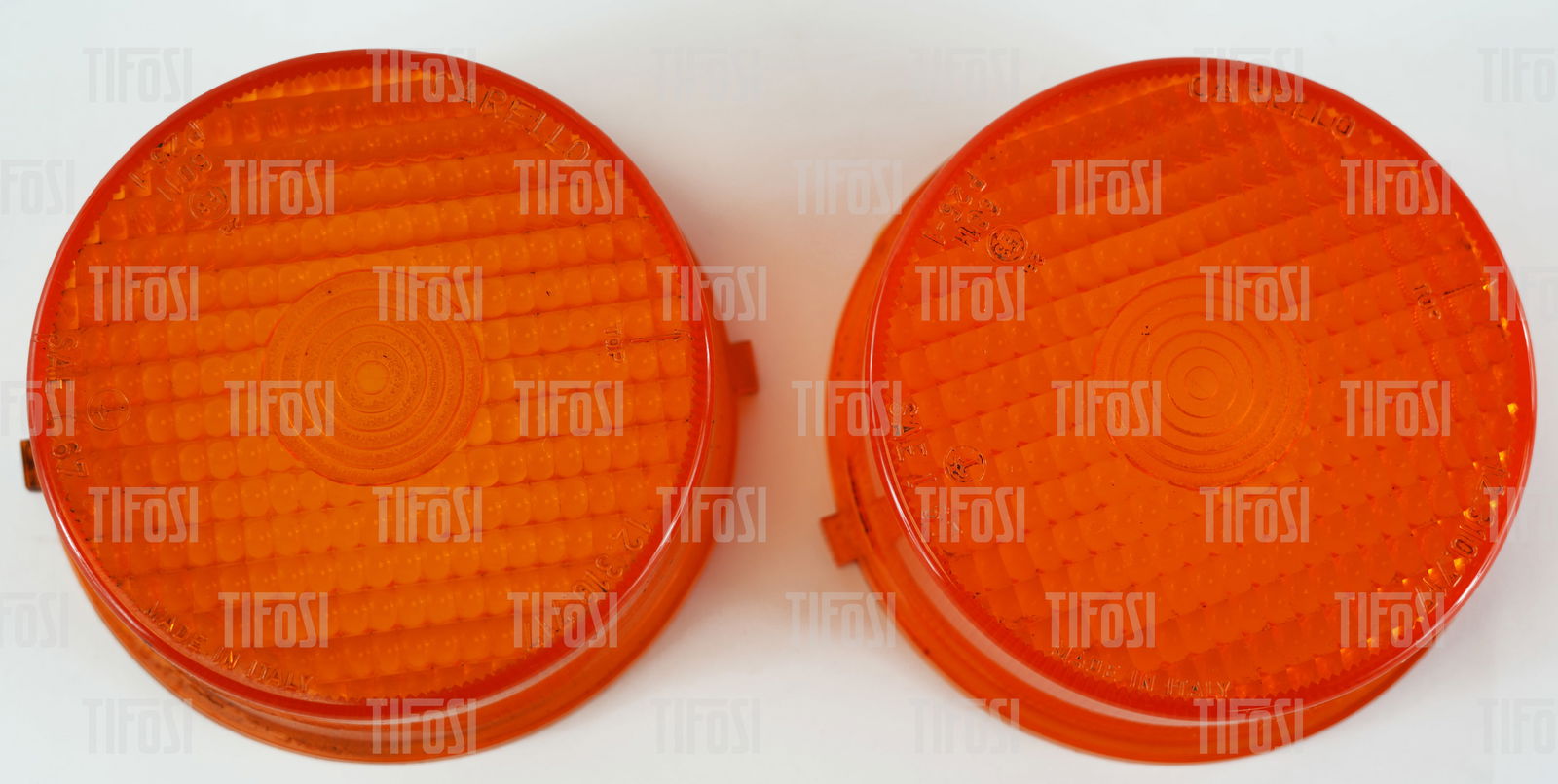 Ferrari 308 Carello Indicator Light Lens NOS: A pair of new old stock Ferrari 308 indicator lenses by Carello.
