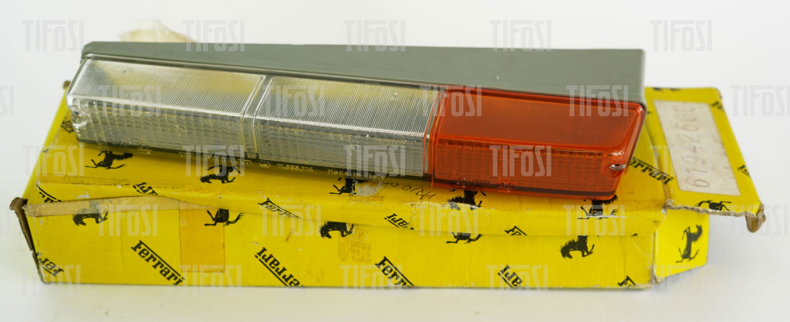 Ferrari 328 Front Lens NOS: A new old stock Ferrari 328 front indicator lens unit, still in Ferrari packaging. Rare.