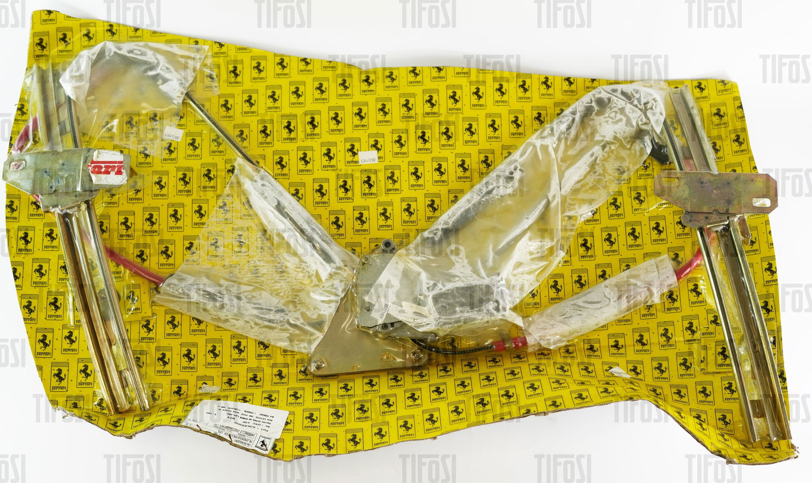 Ferrari 348 355 LH Window Lifter Mechanism NOS: A new old stock Ferrari window lifter mechanism to suit Ferrari 348 and 355 Spider. Ferrari P/N 63645200.