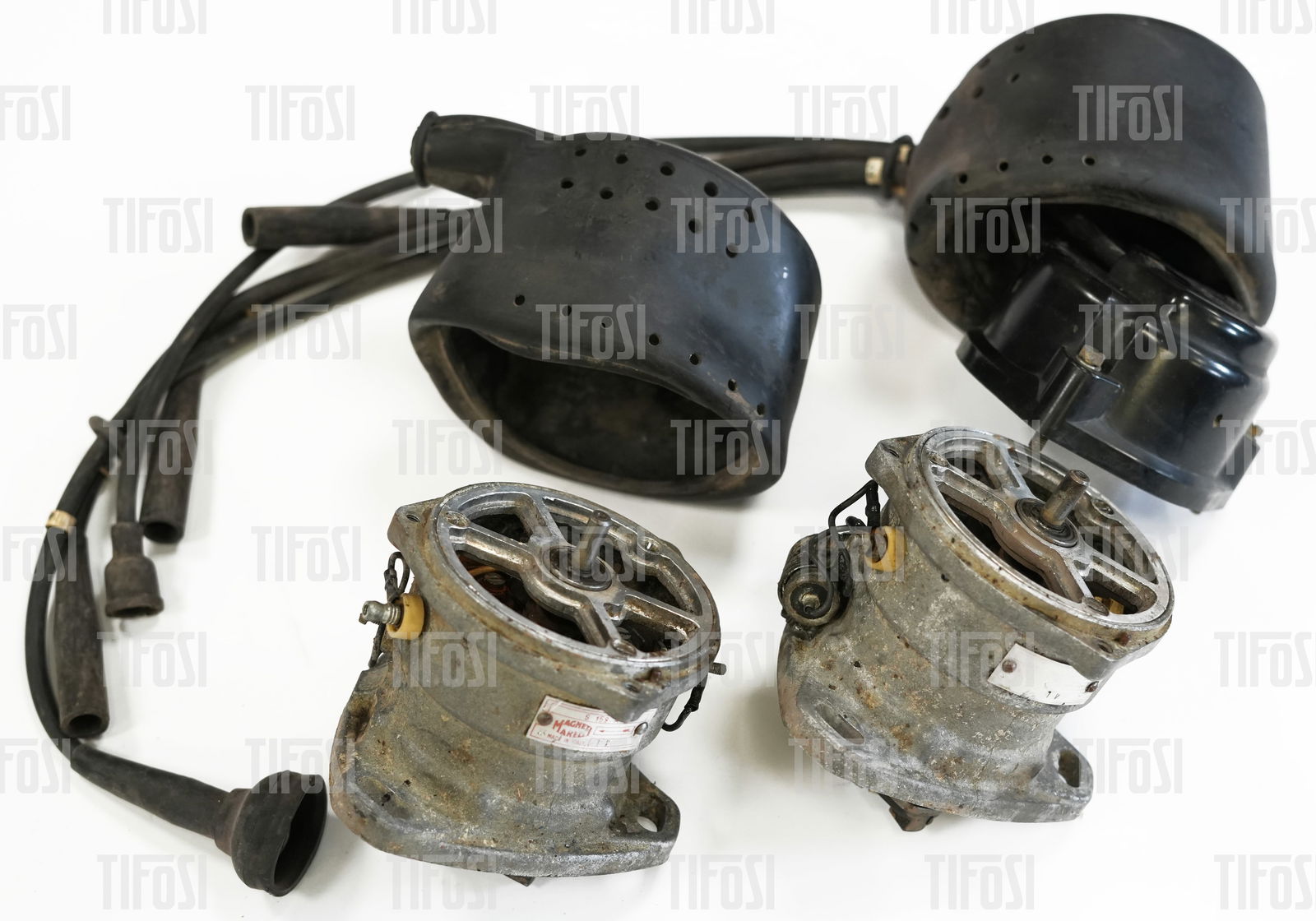 Ferrari 308 Marelli S159A Twin Distributors: A pair of original Magneti Marelli S159A distributors to suit early Ferrari 308 engines. Both distributors spin freely and appear to be in good condition. They are missing rotor arms and one cap. The