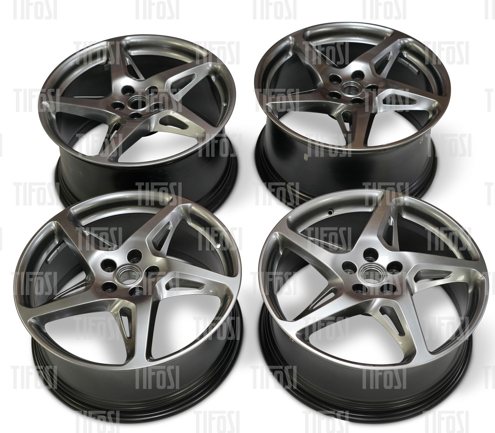 Ferrari 458 Wheel Set Gunmetal: A set of genuine Ferrari 458 wheels. 20 inch, gunmetal grey finish, presented in very good lightly used condition.