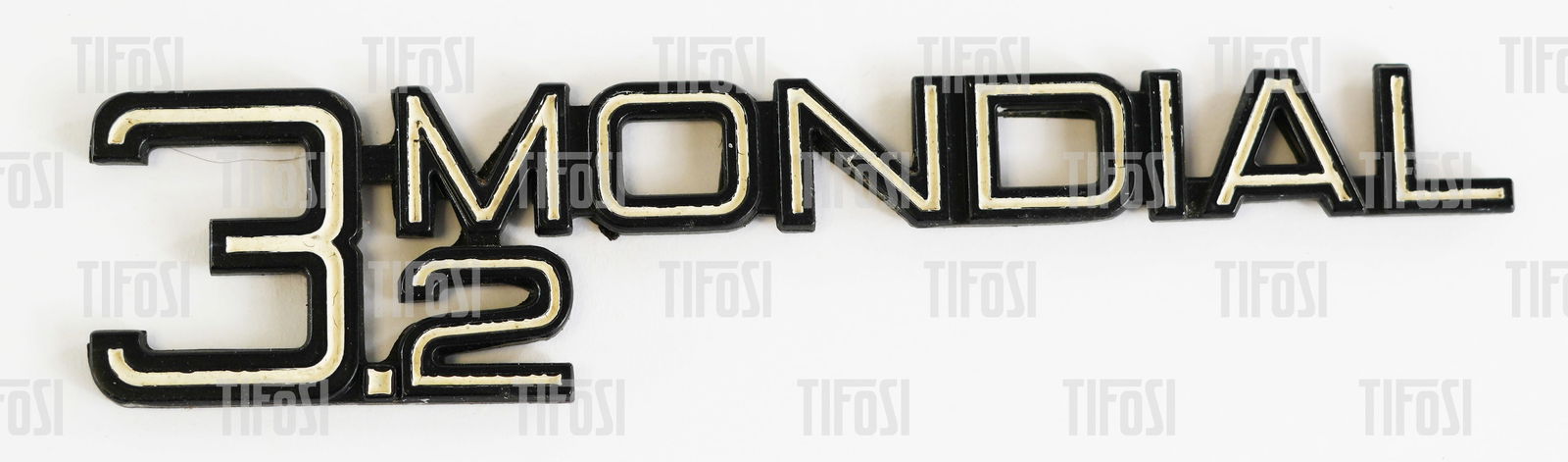 Ferrari Mondial 3.2 Script Badge: An original Ferrari 3.2 Mondial script badge, excellent condition.