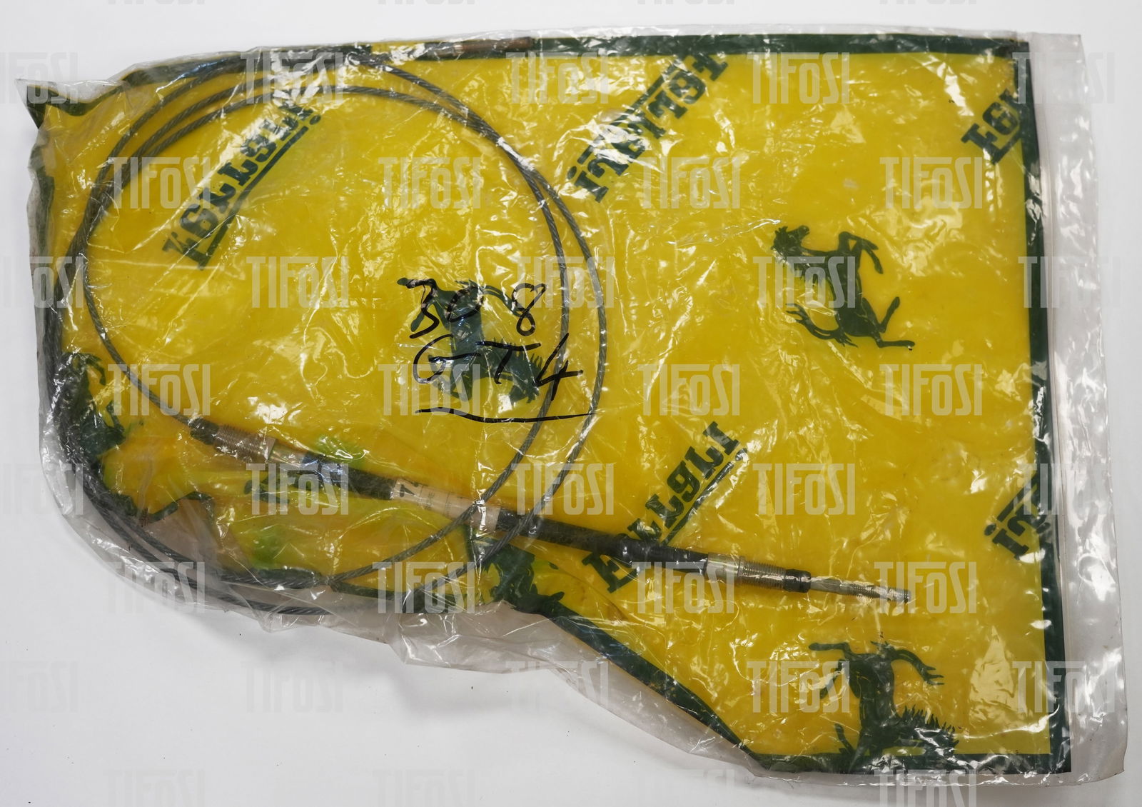 Ferrari 308 GT4 Dino Clutch Cable NOS: A new old stock genuine Ferrari 308 GT4 clutch cable.