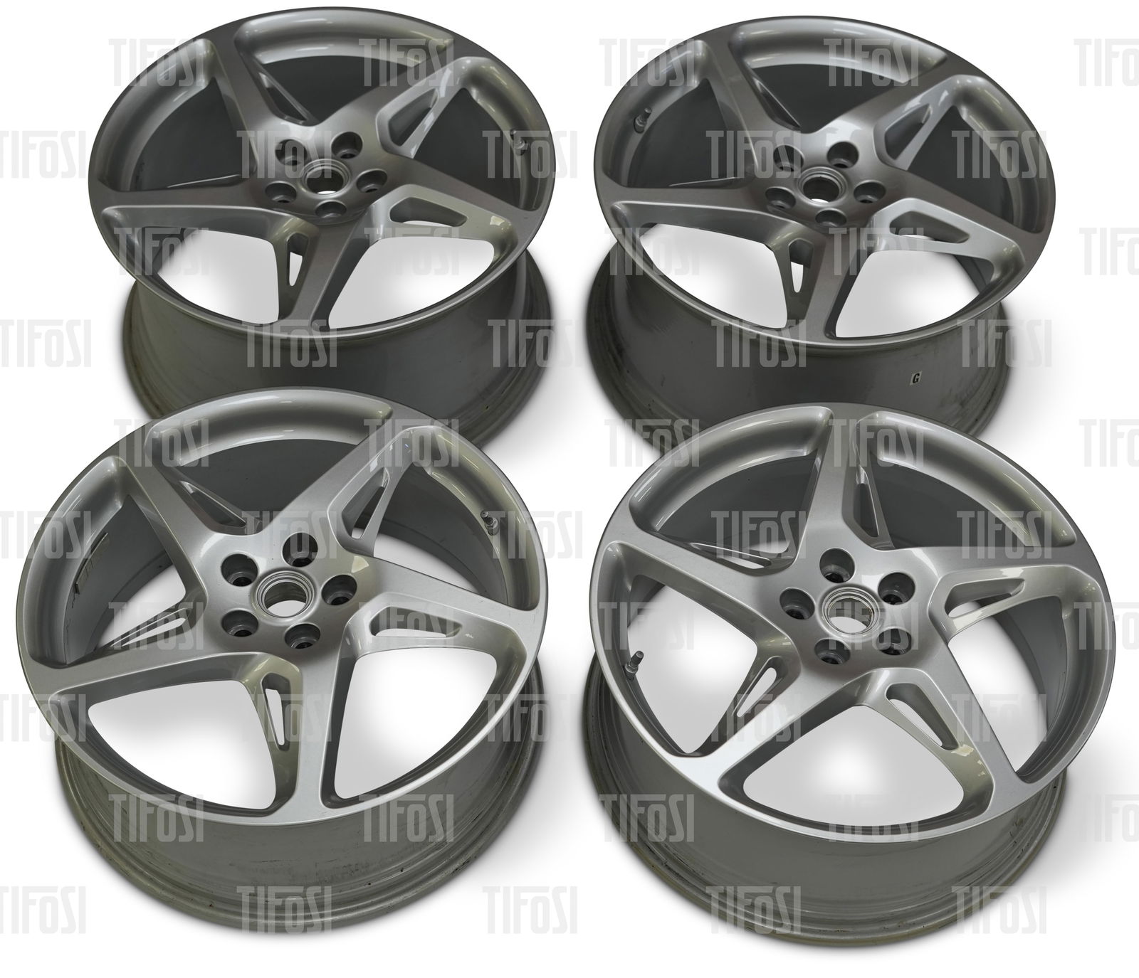Ferrari 458 Wheel Set Silver: A set of genuine Ferrari 458 wheels. 20 inch, silver finish, presented in very good lightly used condition.