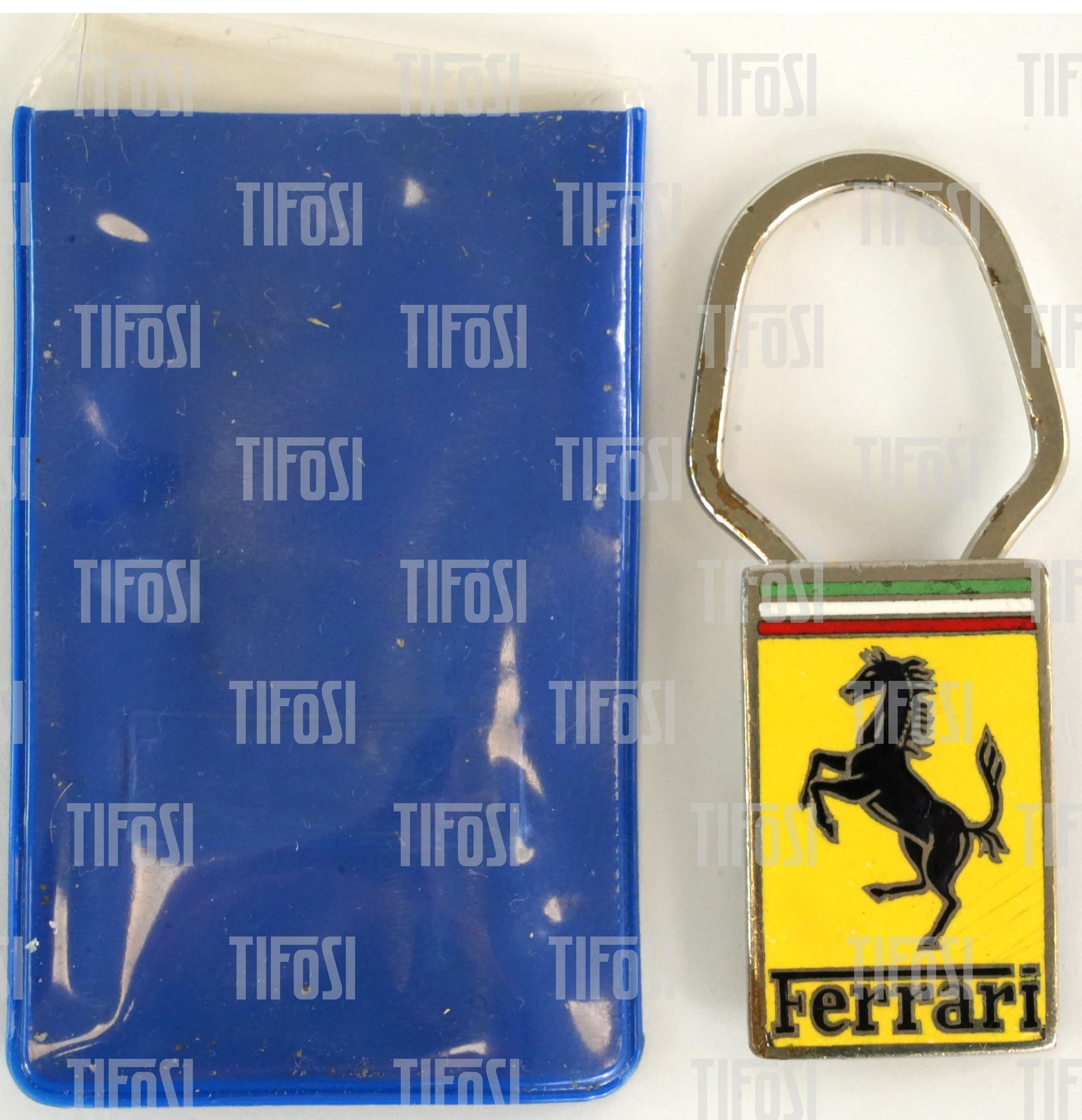 Renzo Medici Estate: Ferrari Enamel Keyring by OMEA: A rare original enamel Ferrari keyring, dating from the late 1960s or early 1970s, produced by famed enamelists OMEA. It is in good condition and supplied in a period plastic pouch.