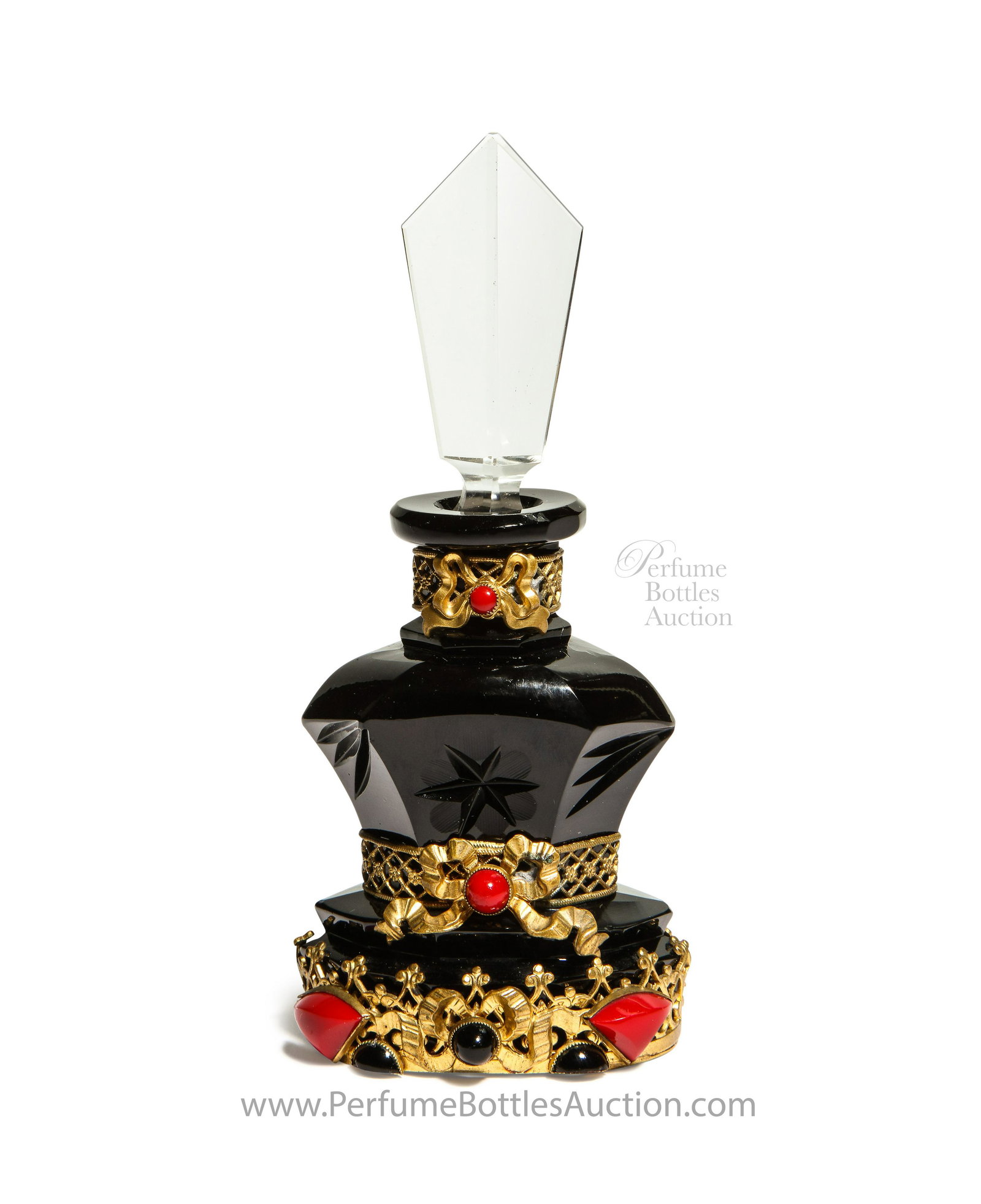 1920s Czech black crystal perfume bottle with red: 1920s Czechoslovakian, black crystal perfume bottle, clear paneled stopper, three bands of jeweled gilt filigree metalwork. 5 1/4 in.
