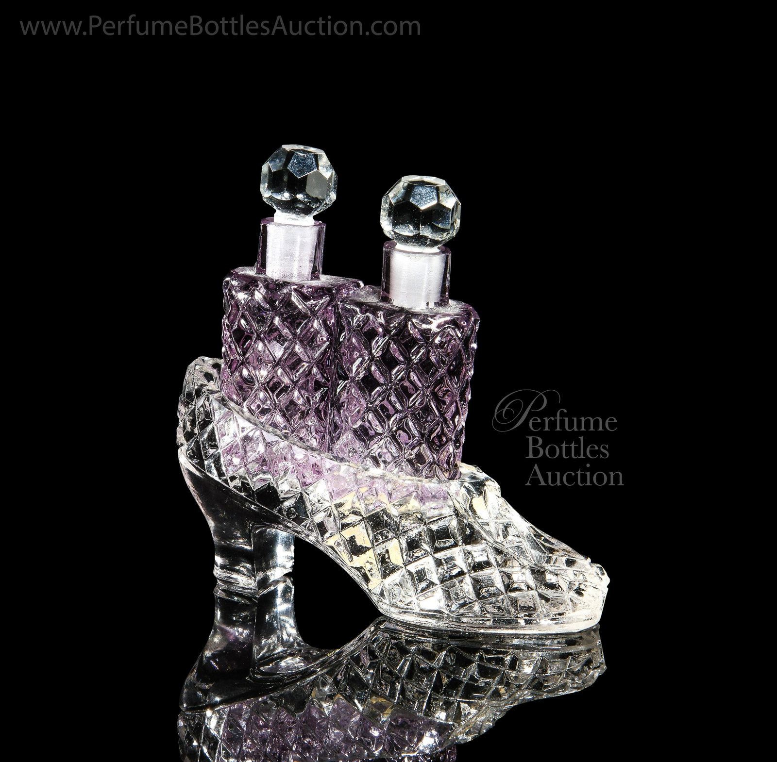 1930s Czechoslovakian pressed glass perfume bottle set: 1930s Czechoslovakian pressed glass perfume bottle set, as a high-heel slipper holding two bottles with stoppers. MIC foil label. 3 in.