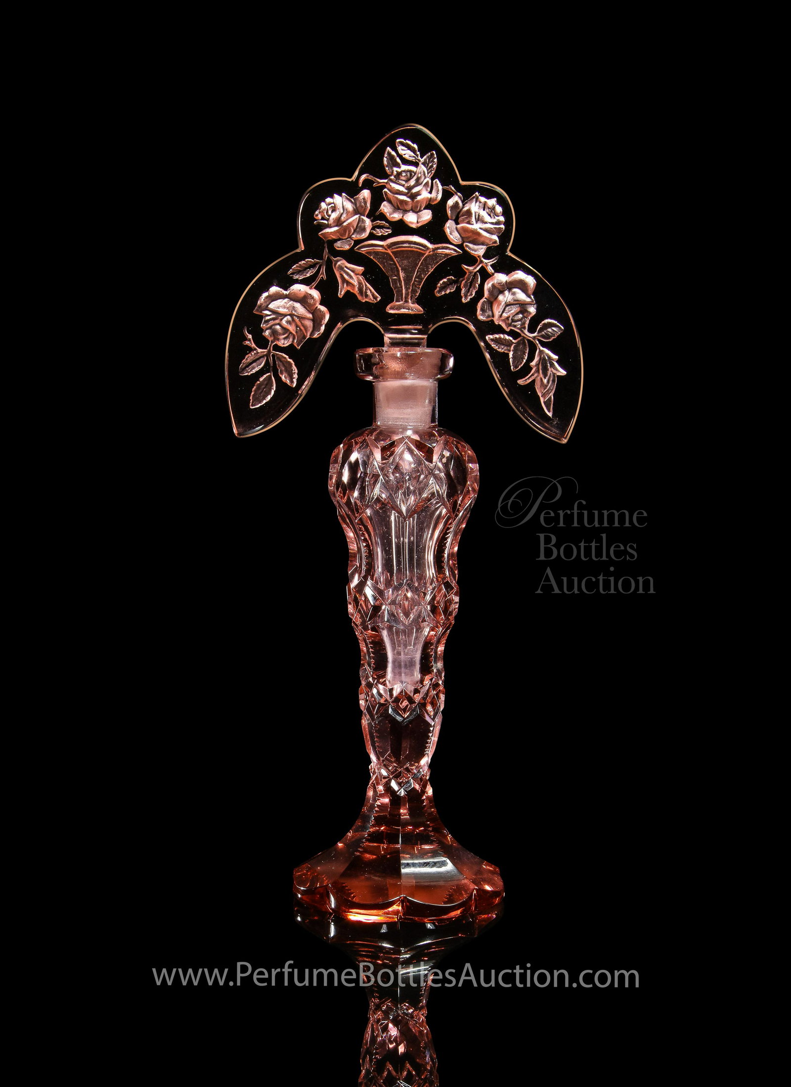 1930s Czechoslovakian pink crystal tiara perfume bottle: 1930s Czechoslovakian pink crystal perfume bottle and intaglio tiara stopper, dauber. MIC in circle. Minor chip to one facet. 8 1/4 in.