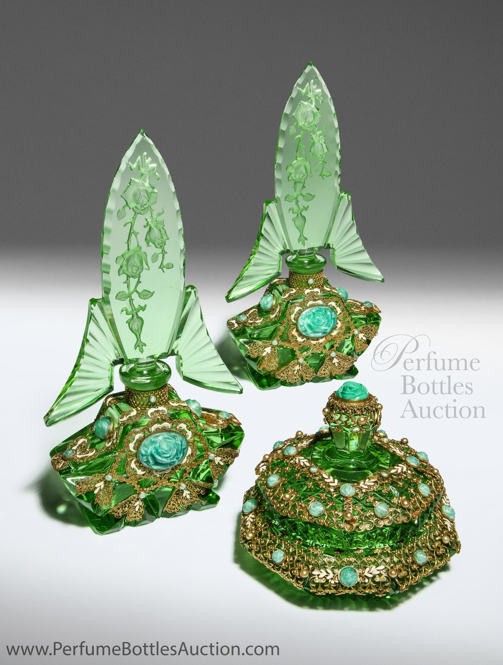 1930s Czech Josef Schmidt green crystal vanity set: 1930s Czechoslovakian, Josef Schmidt green crystal vanity set on matching jeweled mirror tray, two perfume bottles, intaglio stoppers, daubers, powder box, jeweled and enameled gilt filigree metalwork