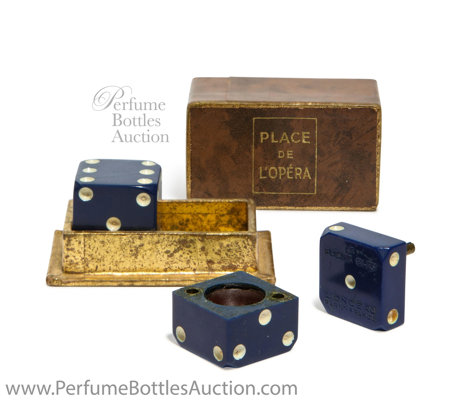 1925 Lionceau “Place de l’Opéra” Solid Perfumes w/Box: 1925 Lionceau “Place de l’Opéra” solid perfume presentation Le Fleuve Bleu, two deep blue Bakelite dice, each holds scented wax, molded labeling, box. Each 3/4 in.