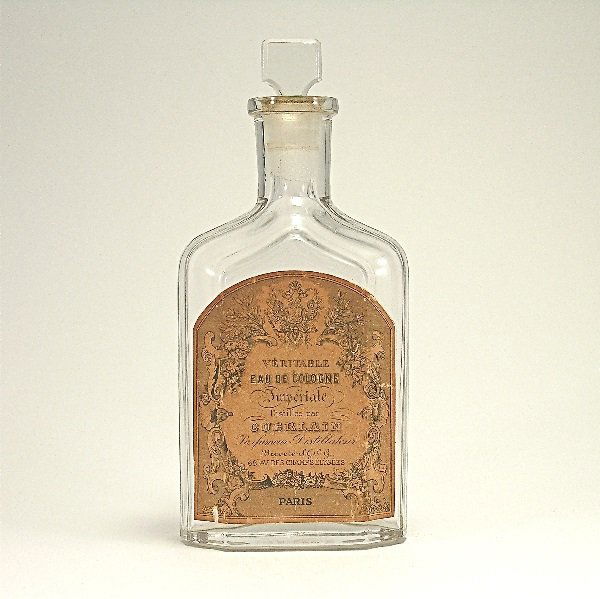 1920s Guerlain Imperiale Cologne Bottle: 176. 1920s Guerlain Imperiale cologne bottle in clear glass with label. Frozen stopper. 6 3/8 in.
