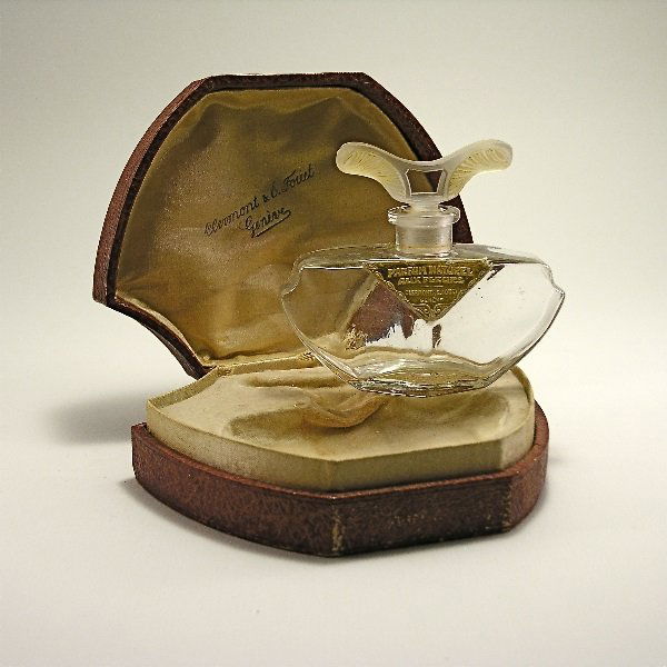 1920s Clermont & E. Fouet Perfume Bottle: 194. 1920s Clermont & E. Fouet Rose Ambree perfume bottle and stopper in clear/frost glass, ochre patina, labels, box. 3 1/4 in.