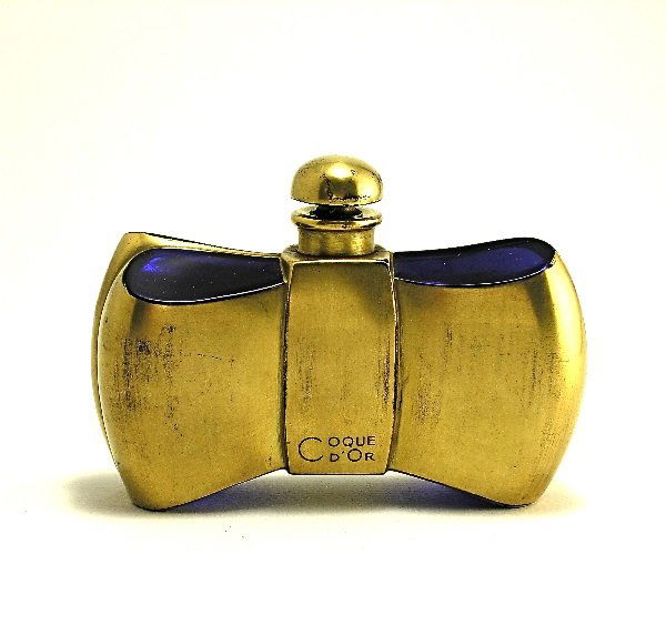 Baccarat 1937 Guerlain Coque d'Or Bottle: 254. Baccarat 1937 Guerlain Coque d'Or perfume bottle and stopper in cobalt crystal with gilt detail. Baccarat mark. Minor gold loss. 3 1/4 in.