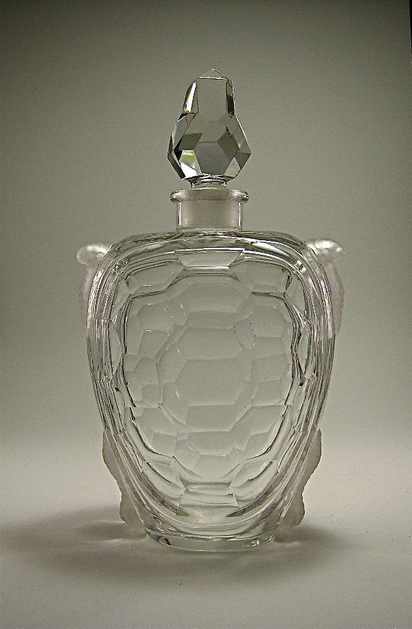 Baccarat 1904 Guerlain Champs Elysees Bottle: 264. Baccarat 1904 Guerlain Champs Elysees perfume bottle and stopper as a turtle in clear crystal, facet cut shell and frosted feet. Unusual size. 9 ½ in.