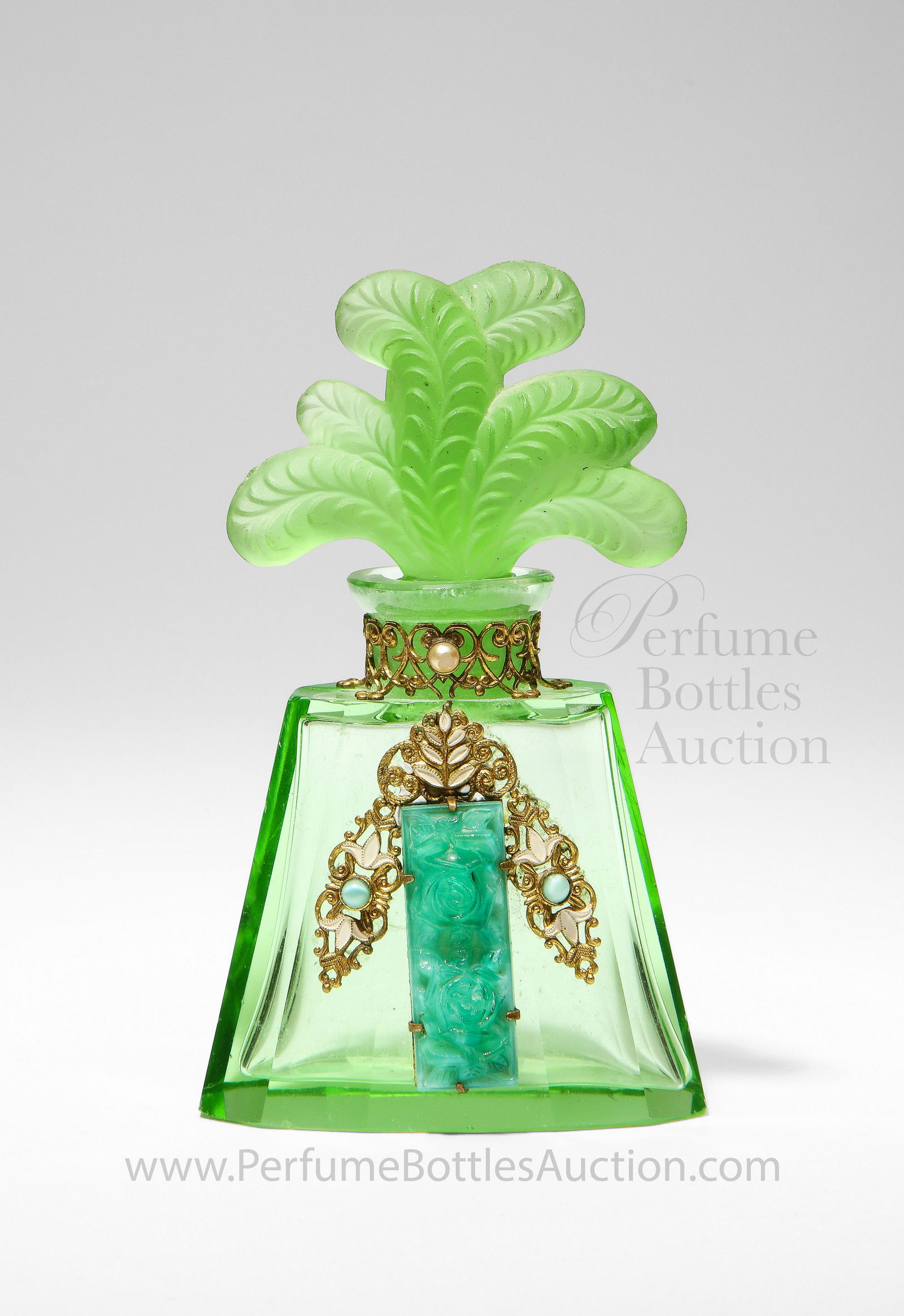 1920s Green Crystal Heinrich Hoffmann Perfume Bottle: c1930 Heinrich Hoffmann Czechoslovakian green crystal perfume bottle and frost "plume” stopper, dauber stub, enameled and jeweled gilt metalwork marked Czechoslovakia; MIC in oval. 4 1/2 in.
