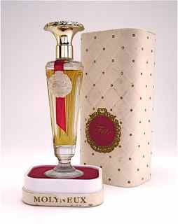 1940s Perfume Bottle for Molyneux "Fete": 1940s Perfume bottle for Molyneux "Fete" in clear glass with metallic plastic screw cap, paper label, in box. 5 3/4 in.