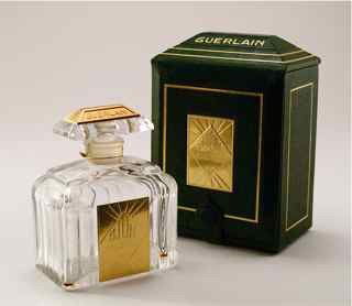 1996 Guerlain Djedi Perfume Bottle: 1996 Guerlain Djedi perfume bottle, clear crystal, stopper mount of gilt bronze, label, box. 1996 limited edition, celebrating 70th year anniversary of the scent. Barry Gibb estate. 3 1/2 in.