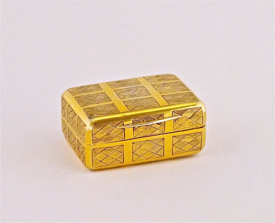 1801 22K English Vinaigrette Box: 1801 English vinaigrette of 22K gold, engraved basket weave finish, pierced interior screen. Gold and London hallmarks. 1 3/8 in. x 7/8in.