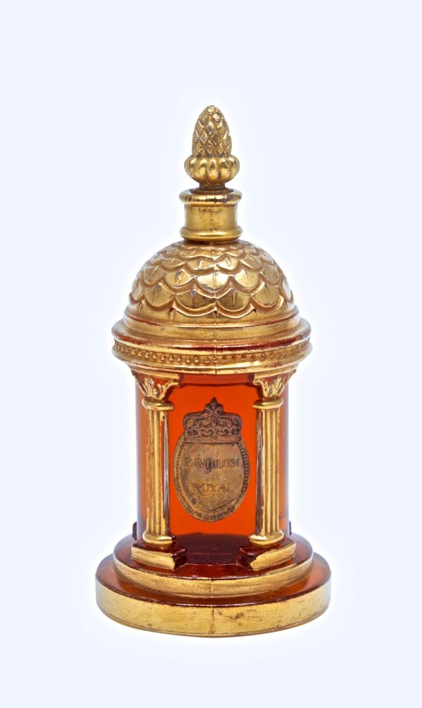 1927 M. Guerlain Pavillion Royal Perfume Bottle: 1927 Marcel Guerlain Pavillion Royal perfume bottle and stopper, clear glass, gilt detail, rare paper label. 4 1/4 in.