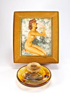 1930s Rigaud Feerie Perfume Bottle: 1930s Rigaud Feerie perfume bottle and stopper, clear/frost glass, label. Fabric box, image of Jean Gabriel Domergue painting “Nu Sur un Champ de Lys” under glass. 1 1/2 in.