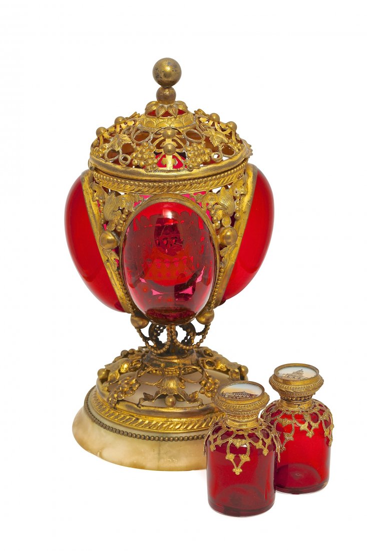 c1850 Baccarat, Palais Royal cranberry crystal scent: c1850 Baccarat, Palais Royal scent casket, convex panels of cranberry crystal, gilt metal open work foot and hinged cover on alabaster base (chip), holds two cranberry crystal perfume bottles, stopper