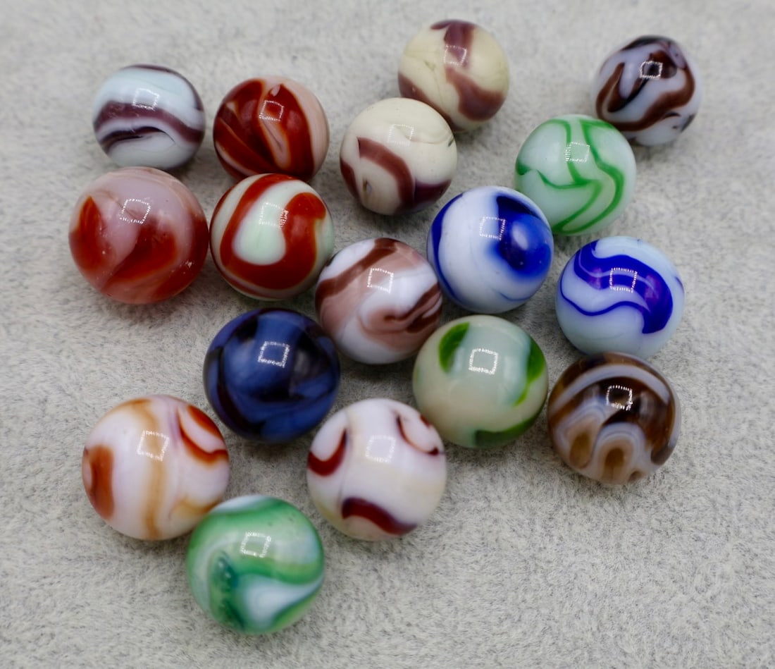 A Large Grouping of Various Agate Swirl Marbles: A nice grouping of West Virginia Swirls. Various Makers. Alley and Ravenswood. Lots of Color Variations. Excellent Conditions.