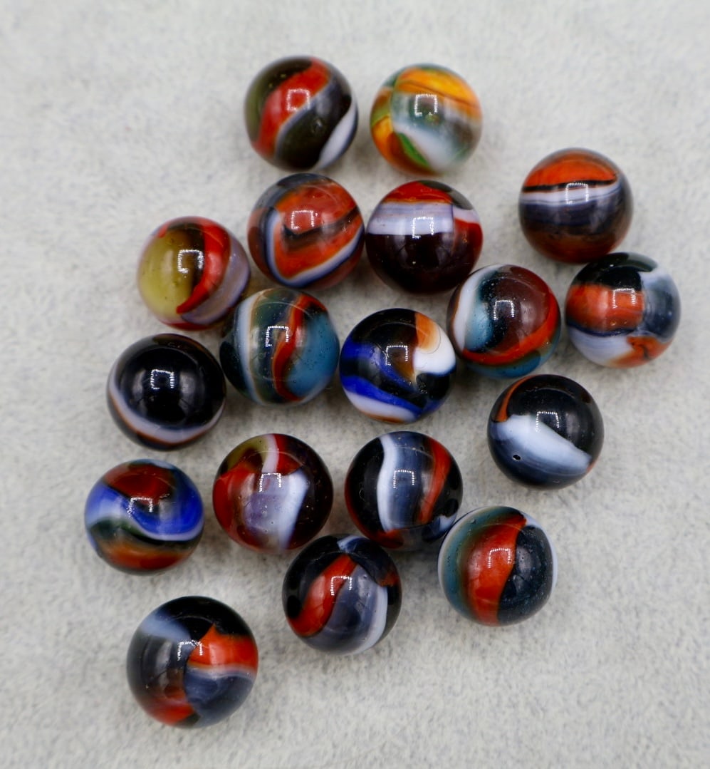 A Large Grouping of PELTIER RAINBO Marbles: Excellent and Highly Collectible Group of Peltier Rainbo Type Marbles. Various Types. Translucent Base. Excellent Condition. Approximately 5/8” Sized.