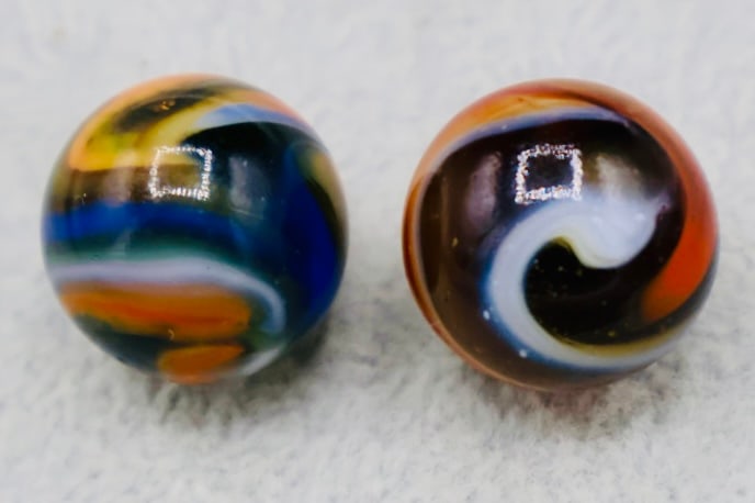 A Pair of PELTIER RAINBO Miller Swirl: A beautiful pair of highly colorful Peltier Miller Swirl Marbles. Excellent Condition. 5/8” Sized.