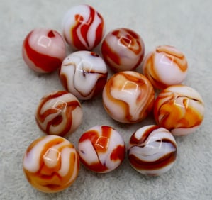 A Large Grouping of Red & Orange Swirl Type Vintage Agate Marbles