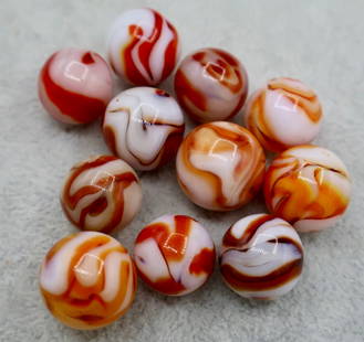 A Large Grouping of Red & Orange Swirl Type Vintage Agate Marbles: A large grouping of Vintage Agate Swirl Marbles. Various Makers. Very Good Condition. All areApproximately 5/8&rdquo;.