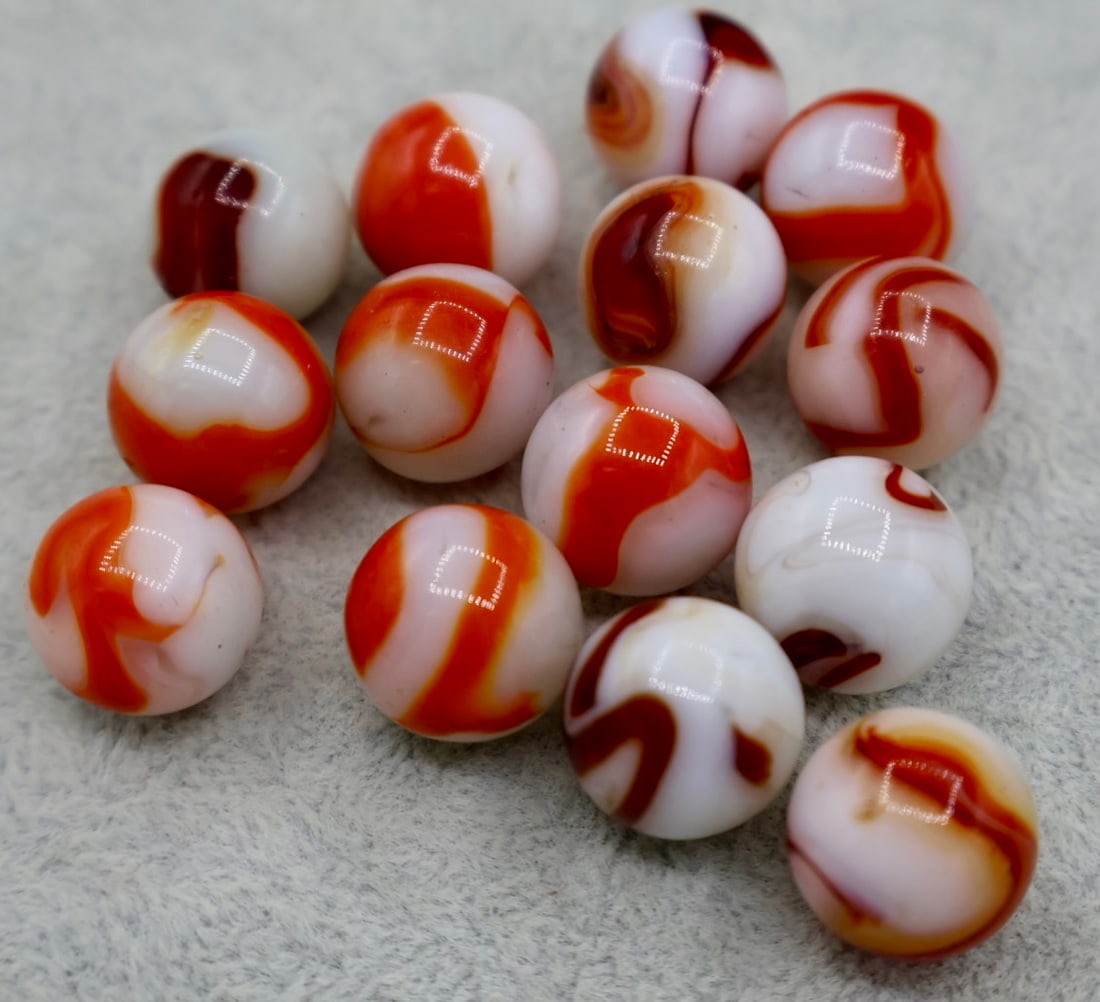 A grouping of Red & White Agate Swirl Marbles (1 of 6)