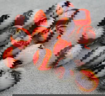 A grouping of Red & White Agate Swirl Marbles: A beautiful grouping of vintage agate marbles. Beautiful swirls and red & orange colors. All are approximately 5/8&rdquo; and are in very good condition.