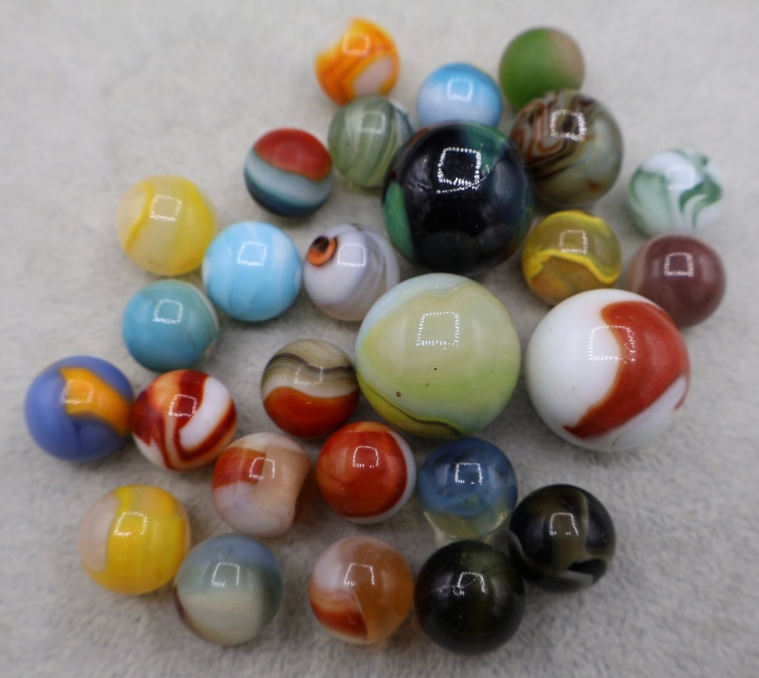 A Grouping of Various Vintage Marbles: Various makers. Various Types like swirl, agate, flame and patch. Various conditions. A variety of vintage marbles from a lifelong collection. Lot 43