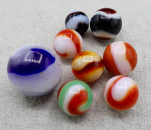 A grouping of early AKRO AGATE Vintage Corkscrew Marbles
