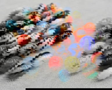 A Grouping of Various Vintage Marbles: Various makers. Various Types like swirl, agate, flame and patch. Various conditions. A variety of vintage marbles from a lifelong collection. Average size 5/8&rdquo;. Lot 69