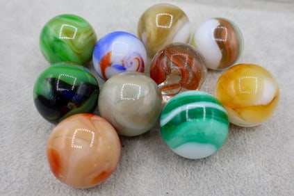 A Grouping of Various Vintage Shooter Sized Boulder Marbles