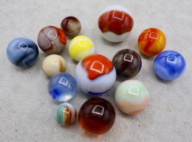 A Grouping of Various Vintage Shooter Sized Boulder Marbles