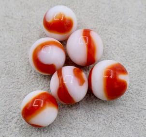A grouping of AKRO AGATE Corkscrew Marbles
