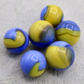 A grouping of AKRO AGATE Early Patch Marbles
