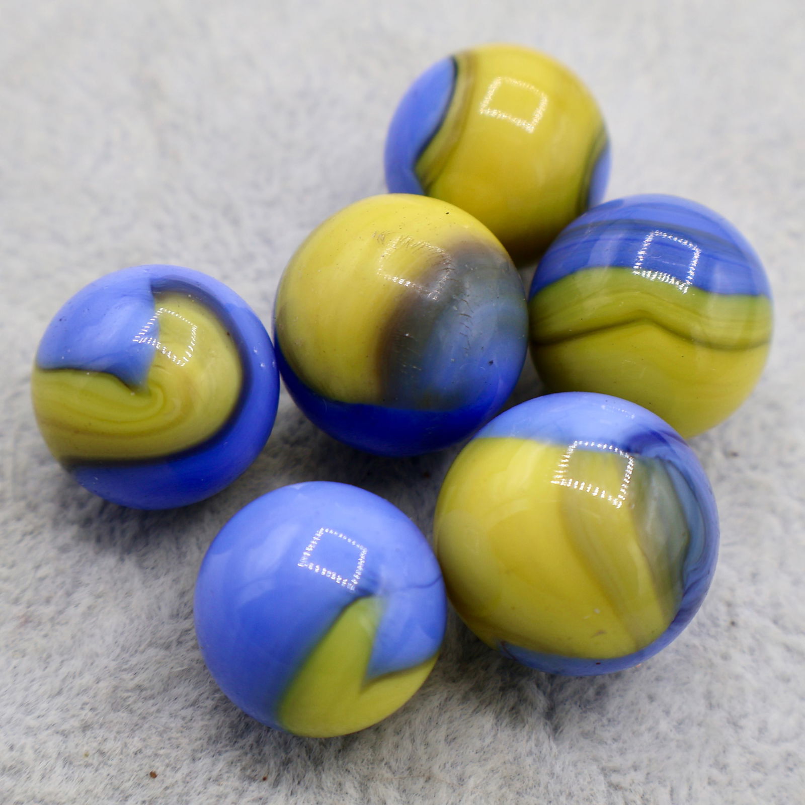 A grouping of AKRO AGATE Early Patch Marbles (1 of 6)