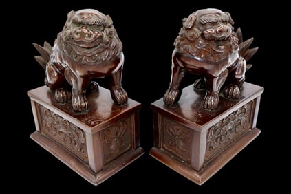 A Fine Pair of Cast Bronze Foo Lions on Plinths