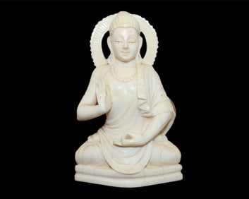 A Carved Southeastern Asian Figure of a Seated Buddha