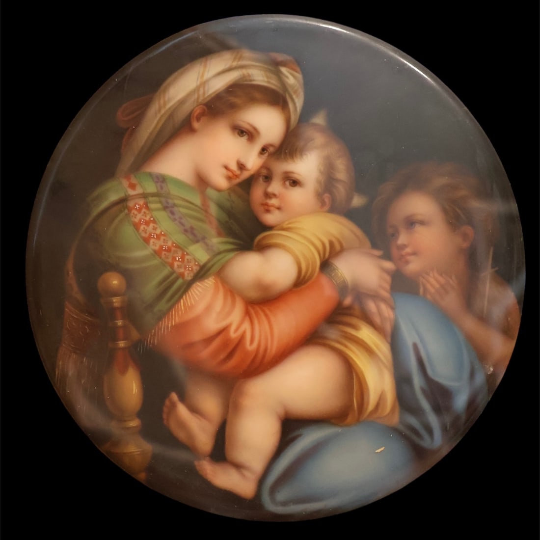 Religious Porcelain Circular Plaque (Madonna Della Sedia): 19th century. Hand painted porcelain. After Raphael. Housed in a custom frame. There is no way to access the back of the piece but it of very high quality possibly KPM. Disc measures 6” diameter