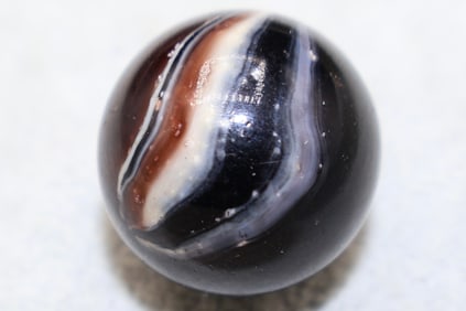 A Large Patch Black Onyx Shooter Marble